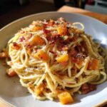 Pasta con zucca e pancetta croccante